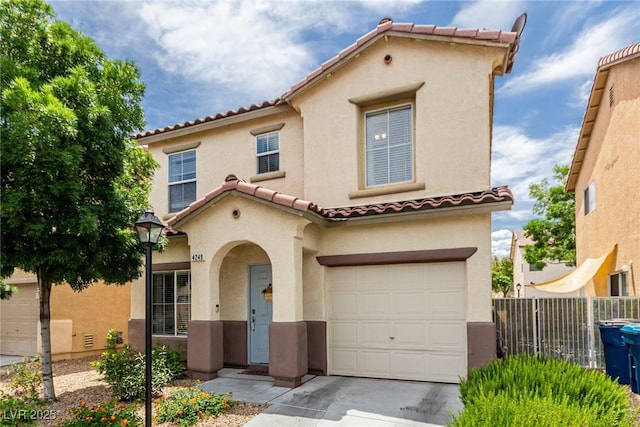 4249 Fleet Dancer St, Las Vegas, NV 89129 - mediterranean / spanish-style home featuring an attached garage, stucco siding, and a tile roof