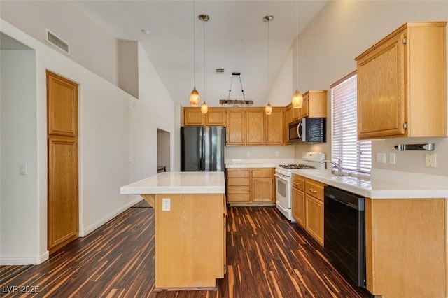 3336 Hidden Ridge St, Las Vegas, NV 89129 - kitchen featuring freestanding refrigerator, white range with gas cooktop, dishwasher, stainless steel microwave, and dark wood-style flooring