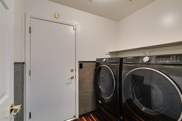 3336 Hidden Ridge St, Las Vegas, NV 89129 - laundry area with washing machine and clothes dryer and dark wood finished floors