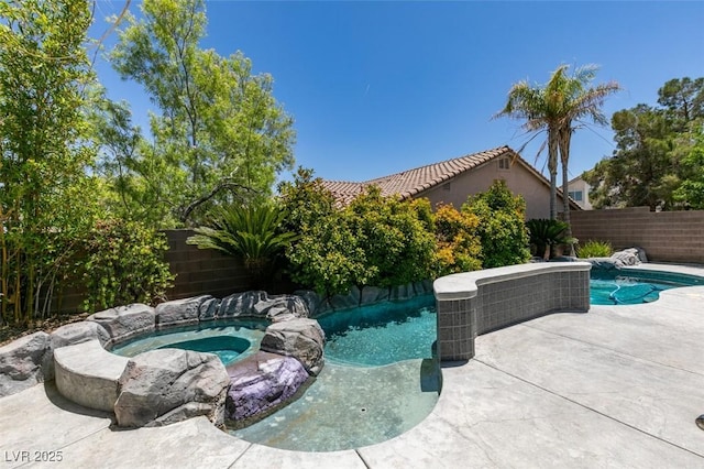 3336 Hidden Ridge St, Las Vegas, NV 89129 - view of swimming pool featuring an in-ground hot tub, a fenced backyard, and a patio