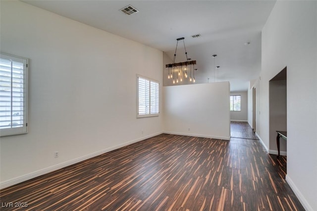 3336 Hidden Ridge St, Las Vegas, NV 89129 - empty room featuring dark wood-style flooring, a high ceiling, and baseboards