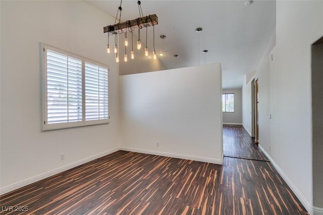 3336 Hidden Ridge St, Las Vegas, NV 89129 - spare room featuring dark wood-style flooring, high vaulted ceiling, and baseboards