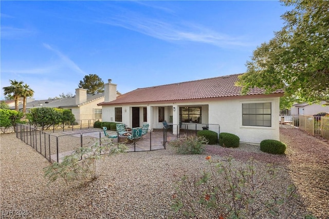 5020 Linkside Dr, Las Vegas, NV 89130 - back of property with a tiled roof, stucco siding, a patio, and a fenced backyard