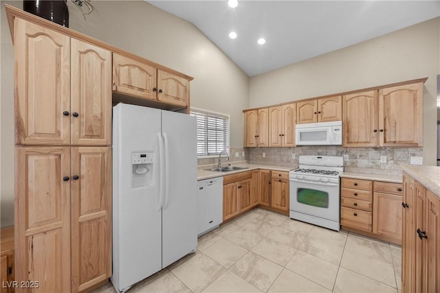 5020 Linkside Dr, Las Vegas, NV 89130 - kitchen featuring white appliances, light brown cabinets, a sink, tasteful backsplash, and recessed lighting