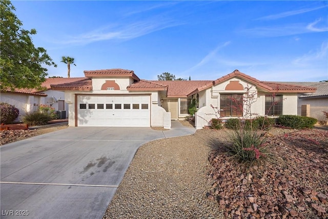 5020 Linkside Dr, Las Vegas, NV 89130 - mediterranean / spanish house featuring an attached garage, stucco siding, concrete driveway, and a tile roof