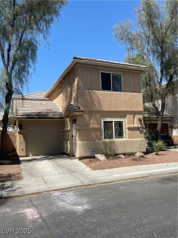 5280 Shreve Ave, Las Vegas, NV 89156 - view of front of property featuring an attached garage, stucco siding, and driveway
