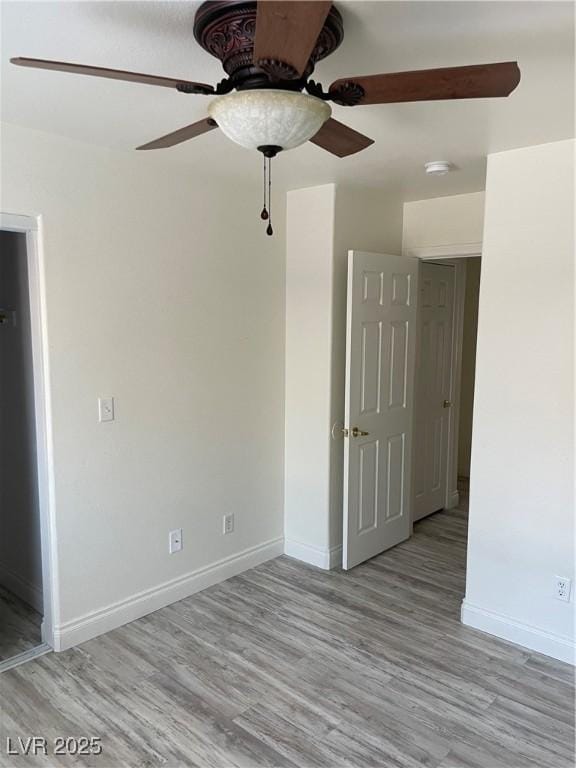 5280 Shreve Ave, Las Vegas, NV 89156 - empty room featuring a ceiling fan, wood finished floors, baseboards, and a smoke detector