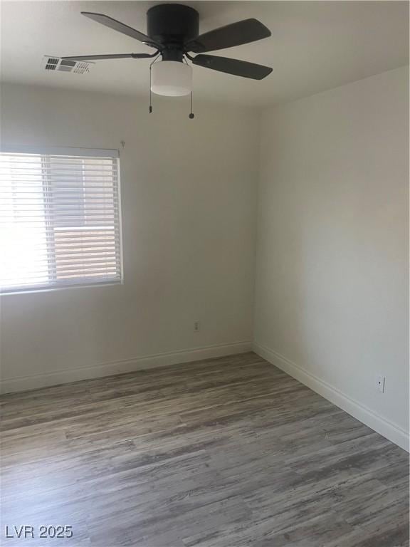 5280 Shreve Ave, Las Vegas, NV 89156 - spare room with ceiling fan, baseboards, and wood finished floors