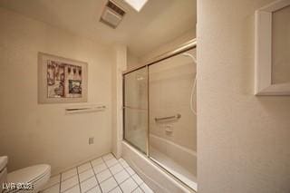 2851 S Valley View Blvd Unit 1199, Las Vegas, NV 89102 - full bathroom with toilet, tile patterned floors, and bath / shower combo with glass door