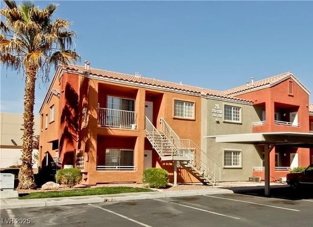 4730 E Craig Rd Unit 1148, Las Vegas, NV 89115 - view of property featuring stairway and uncovered parking