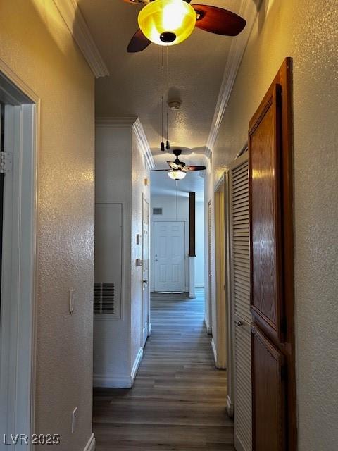 4730 E Craig Rd Unit 1148, Las Vegas, NV 89115 - hall with ornamental molding, dark wood-style flooring, a textured wall, and attic access
