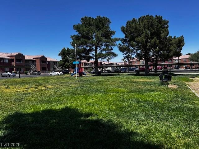 4730 E Craig Rd Unit 1148, Las Vegas, NV 89115 - view of home's community with a lawn