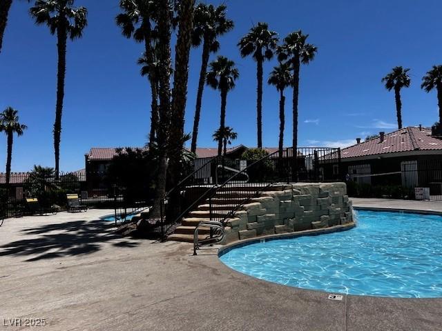 4730 E Craig Rd Unit 1148, Las Vegas, NV 89115 - community pool featuring stairs and a patio