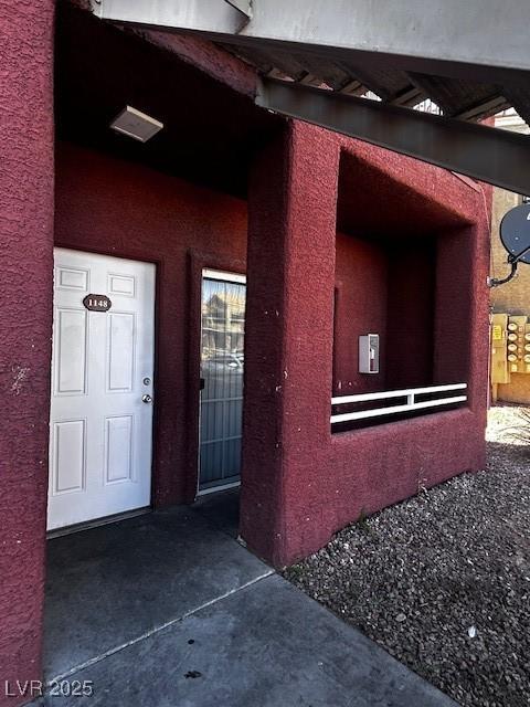 4730 E Craig Rd Unit 1148, Las Vegas, NV 89115 - doorway to property featuring stucco siding