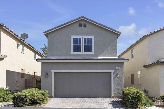 3132 Cartanda Ave, Henderson, NV 89044 - traditional-style house featuring an attached garage, stucco siding, and driveway
