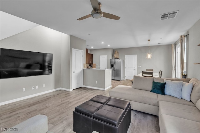 3132 Cartanda Ave, Henderson, NV 89044 - living room with a ceiling fan, light wood-style floors, recessed lighting, and baseboards