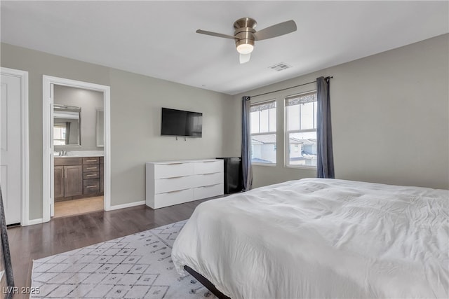 3132 Cartanda Ave, Henderson, NV 89044 - bedroom featuring a sink, dark wood-type flooring, baseboards, ensuite bath, and a ceiling fan