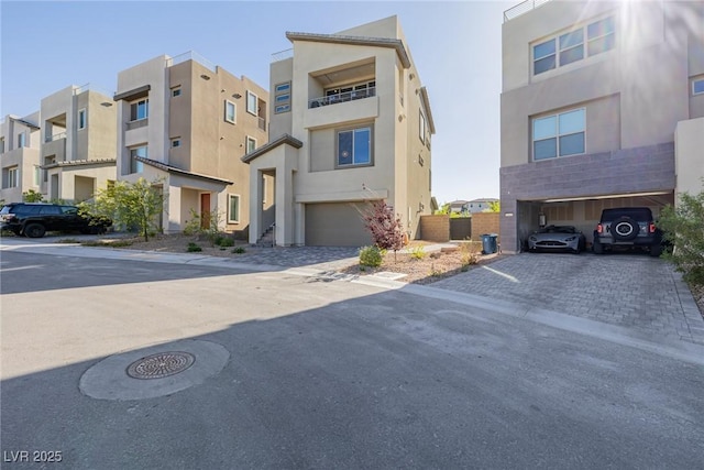 2151 Noble Perch St, Las Vegas, NV 89138 - view of building exterior with an attached garage, a residential view, and driveway