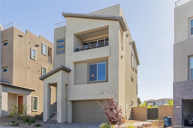 2151 Noble Perch St, Las Vegas, NV 89138 - view of front facade featuring stucco siding, a garage, and driveway