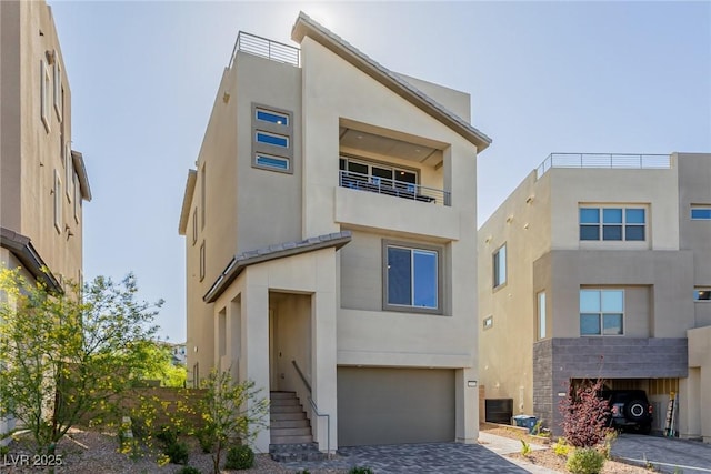 2151 Noble Perch St, Las Vegas, NV 89138 - view of front of house with a garage, stucco siding, and driveway