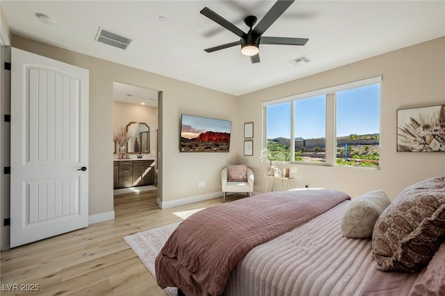2151 Noble Perch St, Las Vegas, NV 89138 - bedroom with light wood-style floors, ensuite bathroom, and a ceiling fan