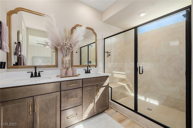 2151 Noble Perch St, Las Vegas, NV 89138 - bathroom featuring double vanity, a stall shower, and wood finished floors