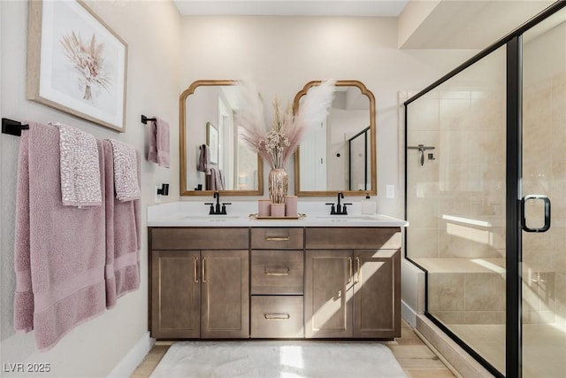 2151 Noble Perch St, Las Vegas, NV 89138 - bathroom featuring double vanity, a stall shower, and wood finished floors