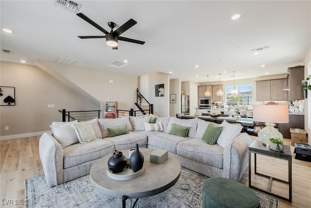 2151 Noble Perch St, Las Vegas, NV 89138 - living area with light wood finished floors, a ceiling fan, recessed lighting, and stairway