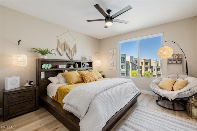 2151 Noble Perch St, Las Vegas, NV 89138 - bedroom with wood finished floors, a ceiling fan, and a chandelier