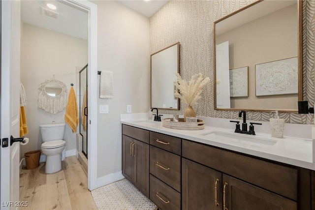 2151 Noble Perch St, Las Vegas, NV 89138 - full bathroom featuring double vanity, a stall shower, and wallpapered walls