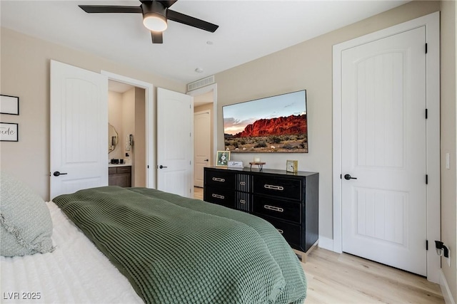 2151 Noble Perch St, Las Vegas, NV 89138 - bedroom with light wood-type flooring, connected bathroom, and ceiling fan