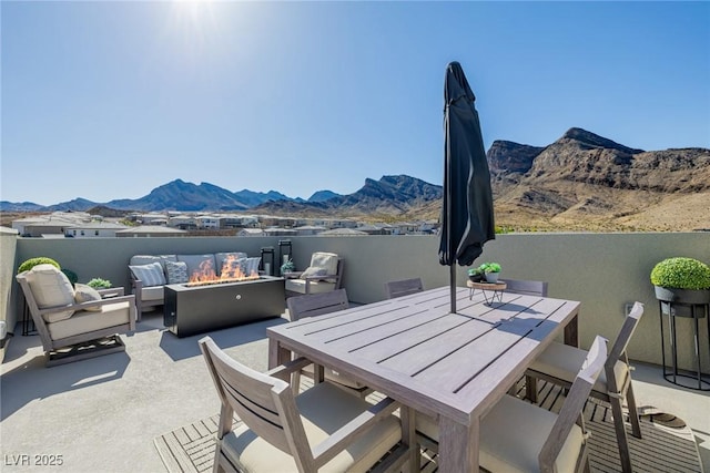 2151 Noble Perch St, Las Vegas, NV 89138 - view of patio / terrace with a mountain view, an outdoor living space with a fire pit, and outdoor dining space