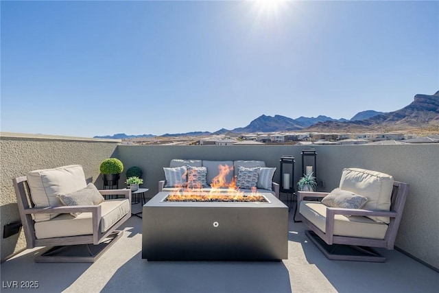 2151 Noble Perch St, Las Vegas, NV 89138 - view of patio featuring a mountain view and an outdoor living space with a fire pit