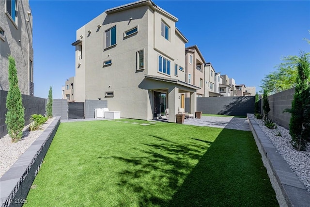 2151 Noble Perch St, Las Vegas, NV 89138 - rear view of house with a fenced backyard, a patio area, and stucco siding