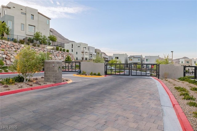 2151 Noble Perch St, Las Vegas, NV 89138 - view of road featuring a residential view, a gate, a gated entry, and curbs