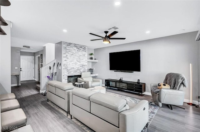 8316 Maplestar Rd, Las Vegas, NV 89128 - living room with baseboards, wood finished floors, ceiling fan, recessed lighting, and built in features