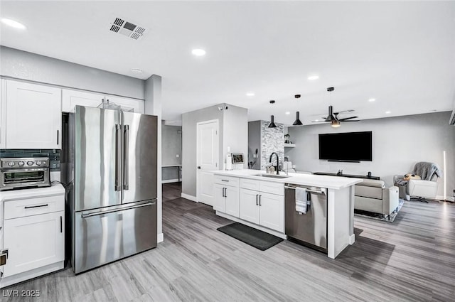 8316 Maplestar Rd, Las Vegas, NV 89128 - kitchen featuring appliances with stainless steel finishes, a sink, open floor plan, a ceiling fan, and recessed lighting
