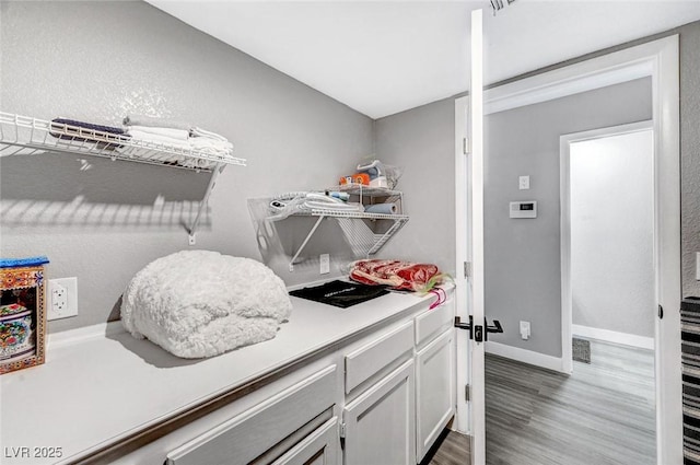 8316 Maplestar Rd, Las Vegas, NV 89128 - laundry room with light wood-style flooring and baseboards