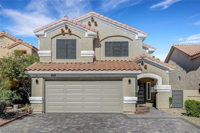 8316 Maplestar Rd, Las Vegas, NV 89128 - mediterranean / spanish-style home with a tiled roof, a garage, decorative driveway, and stucco siding