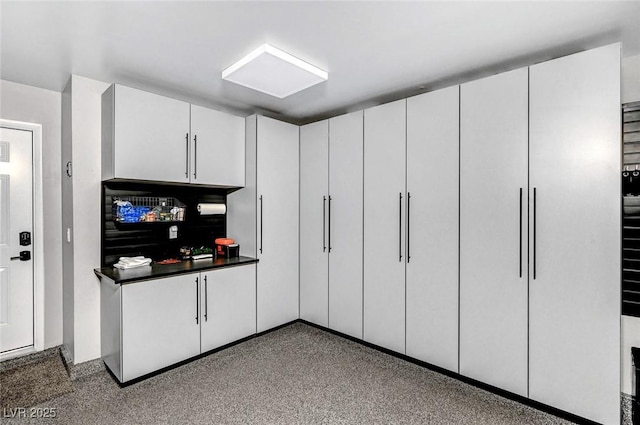 8316 Maplestar Rd, Las Vegas, NV 89128 - kitchen featuring dark countertops and white cabinetry