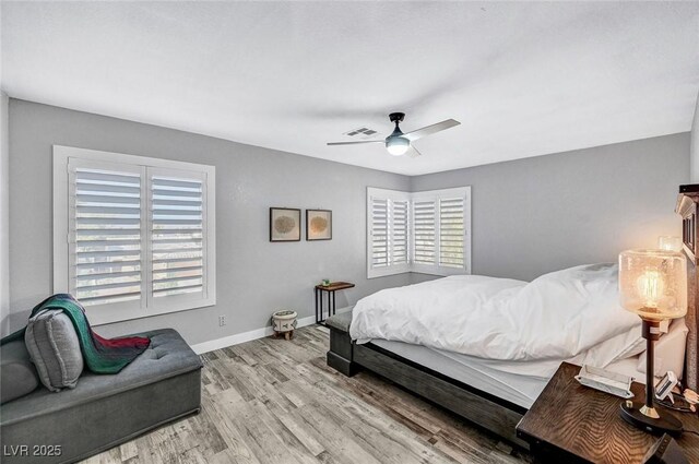 8316 Maplestar Rd, Las Vegas, NV 89128 - bedroom with wood finished floors, multiple windows, baseboards, and a ceiling fan