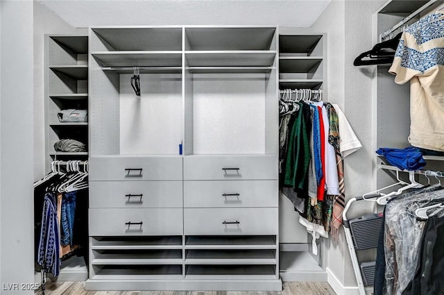 8316 Maplestar Rd, Las Vegas, NV 89128 - walk in closet with wood finished floors