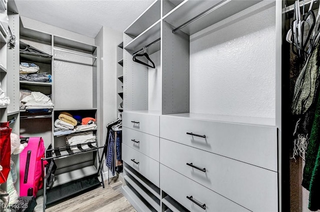 8316 Maplestar Rd, Las Vegas, NV 89128 - walk in closet featuring wood finished floors