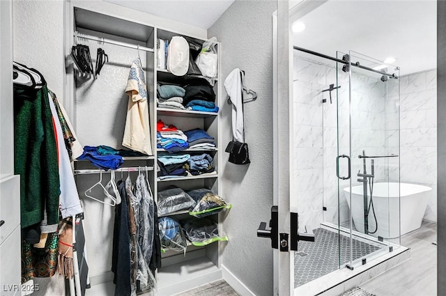 8316 Maplestar Rd, Las Vegas, NV 89128 - spacious closet with wood finished floors