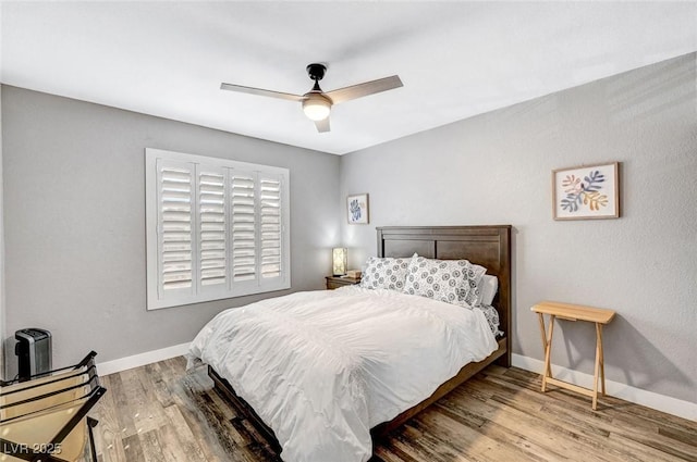 8316 Maplestar Rd, Las Vegas, NV 89128 - bedroom featuring baseboards, wood finished floors, and ceiling fan