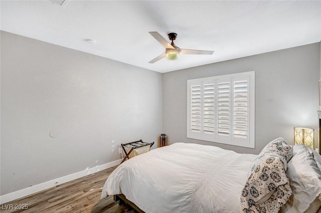 8316 Maplestar Rd, Las Vegas, NV 89128 - bedroom featuring wood finished floors, baseboards, and a ceiling fan