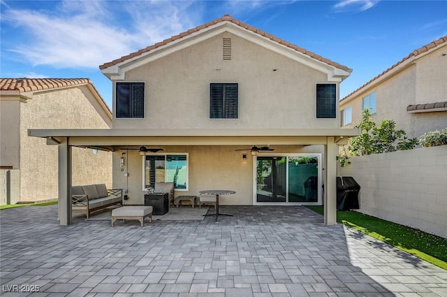 8316 Maplestar Rd, Las Vegas, NV 89128 - back of property featuring ceiling fan, stucco siding, an outdoor living space, a patio area, and a tiled roof