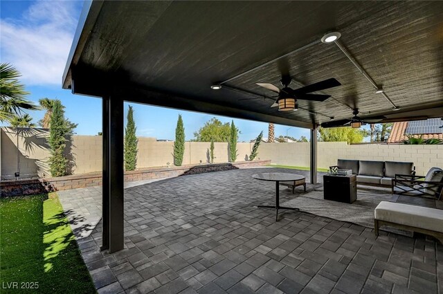 8316 Maplestar Rd, Las Vegas, NV 89128 - fenced backyard featuring an outdoor living space, a patio, and a ceiling fan
