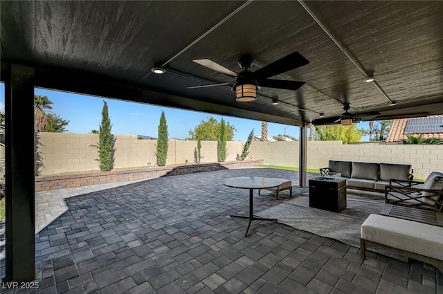 8316 Maplestar Rd, Las Vegas, NV 89128 - fenced backyard featuring an outdoor hangout area, ceiling fan, and a patio area