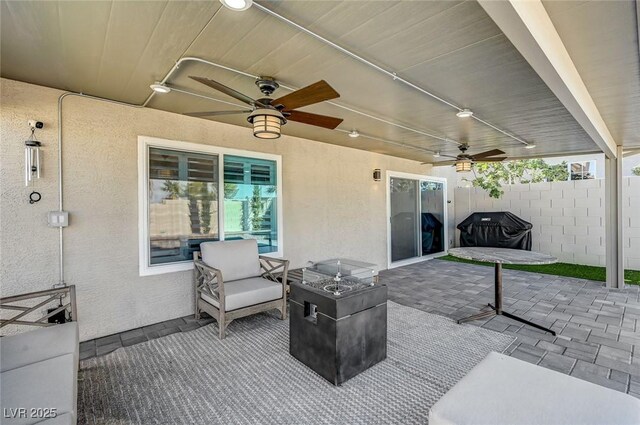 8316 Maplestar Rd, Las Vegas, NV 89128 - view of patio / terrace with a ceiling fan and an outdoor fire pit